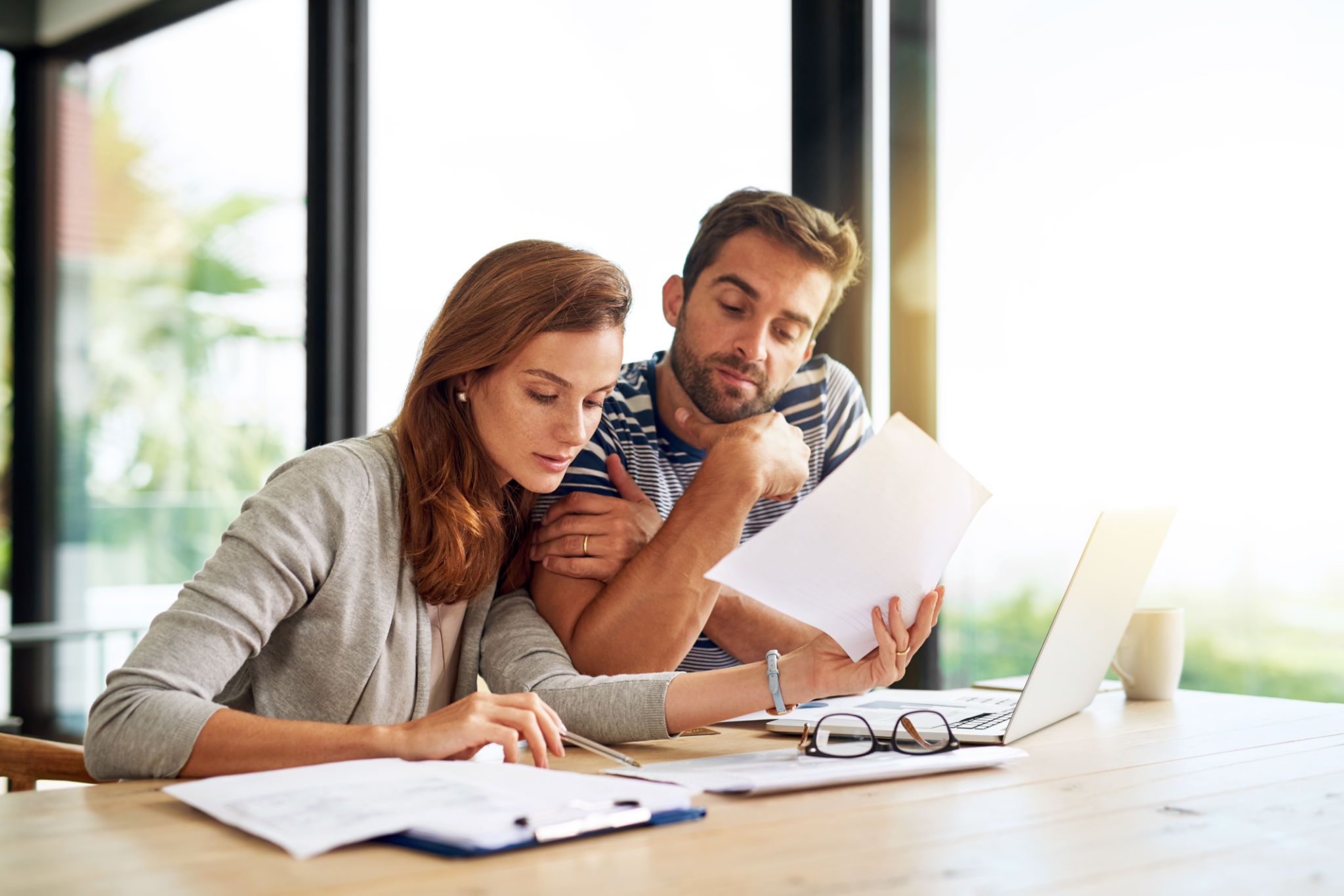 Homeowner reviewing mortgage refinance documents